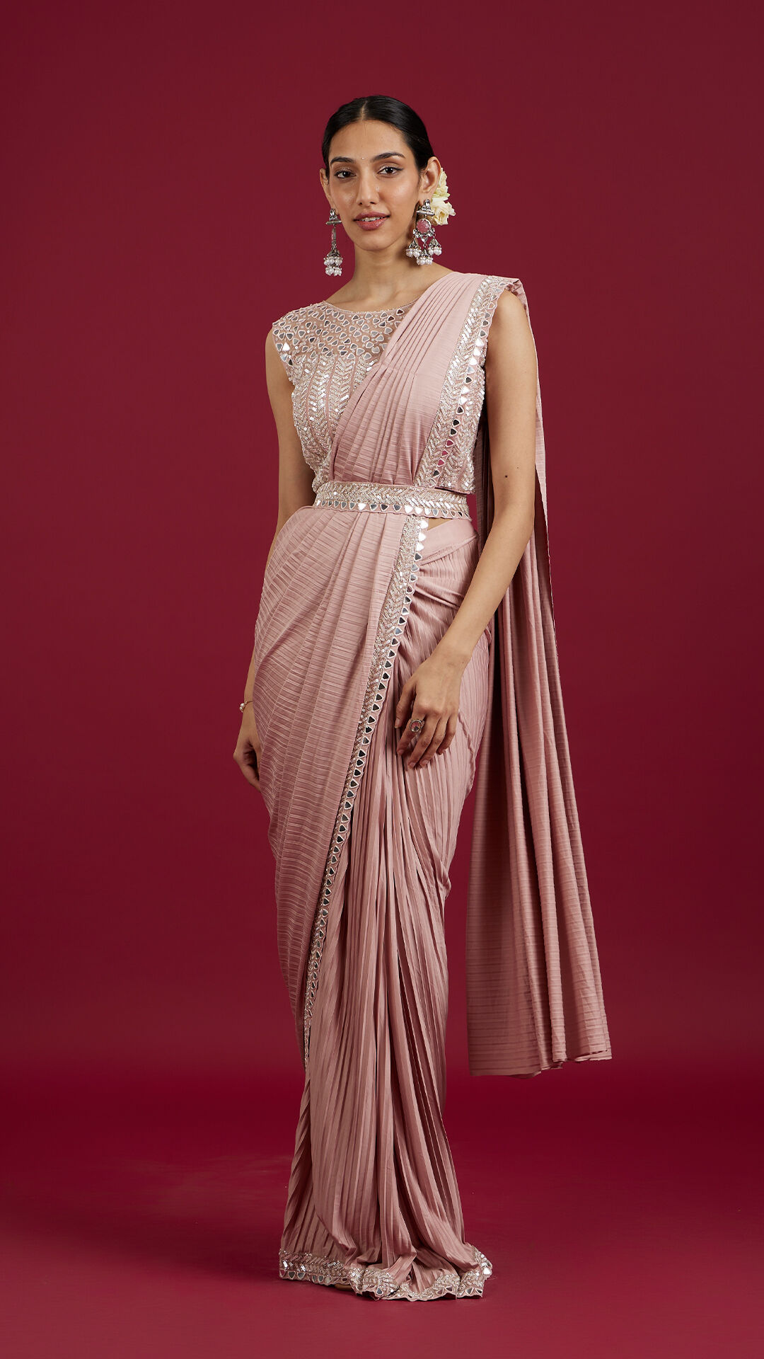 Women flaunting her beautiful pink mirror work saree 